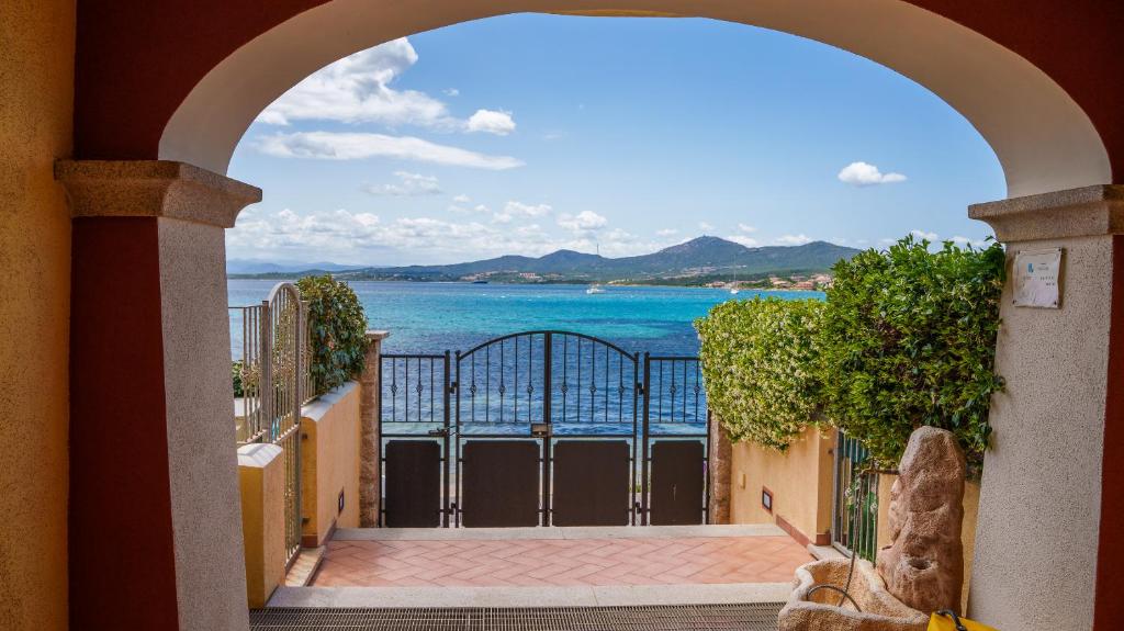a view of the ocean from a balcony at Welcomely - La Porta Sul Mare in Golfo Aranci