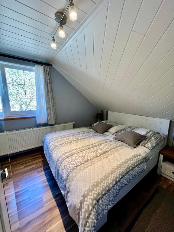 Postel nebo postele na pokoji v ubytování Apartmány v ráji (Českém)
