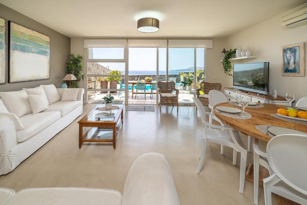 A seating area at VV Vista Oceano by HH - Ocean view with private pool