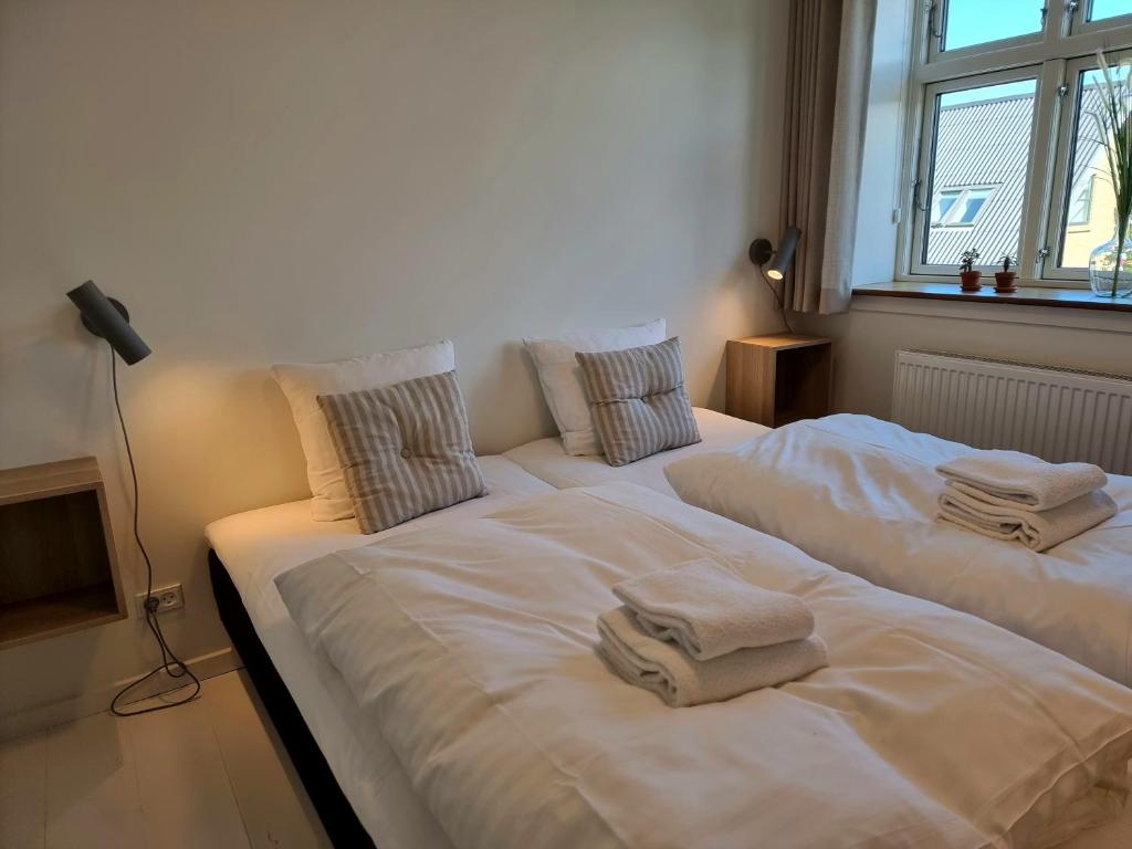 Postel nebo postele na pokoji v ubytování Skovsgård Hotel