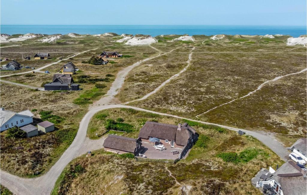 an aerial view of a house and the ocean at Pet Friendly Home In Hvide Sande With House A Panoramic View in Havrvig