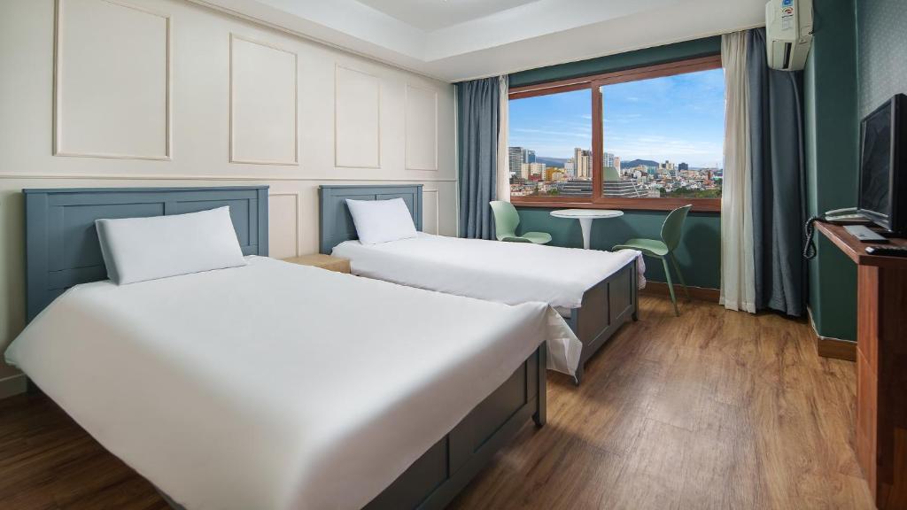 Postel nebo postele na pokoji v ubytování Hiker Hotel