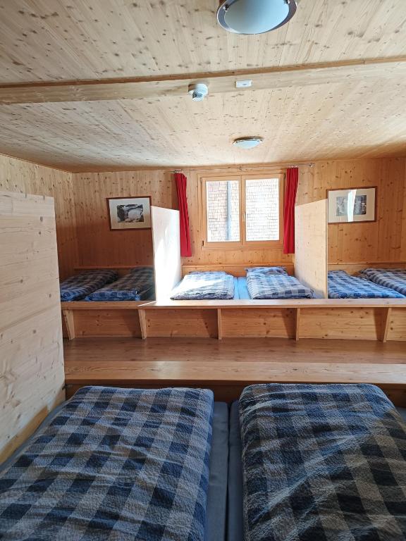 Postel nebo postele na pokoji v ubytování Berghaus Sulzfluh