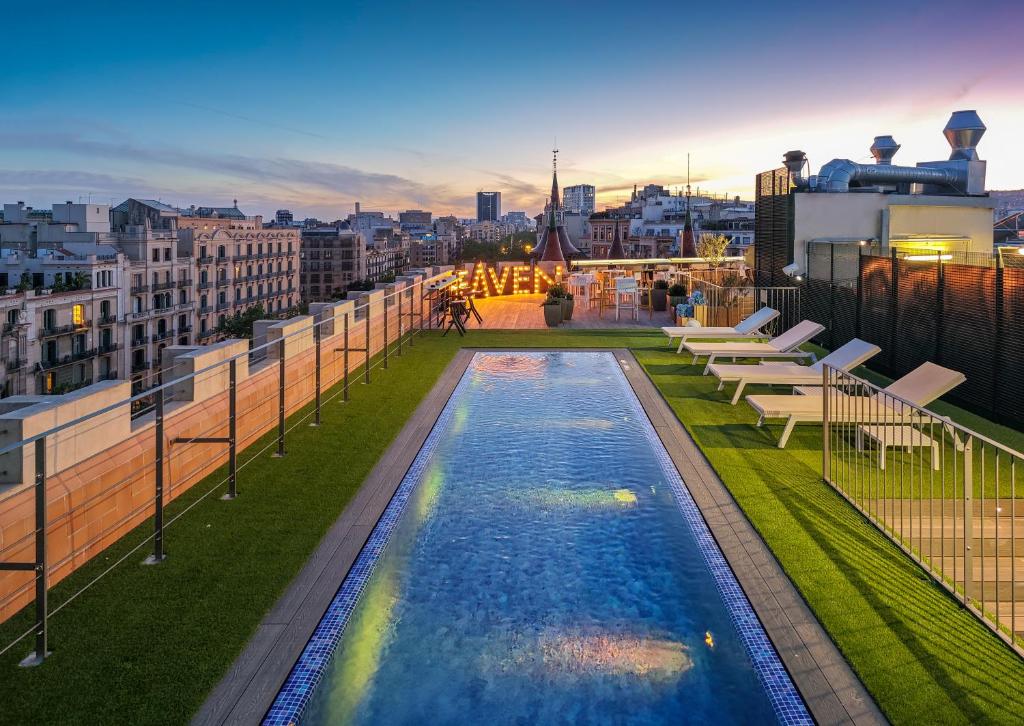 a swimming pool on the roof of a building at Occidental Diagonal 414 in Barcelona