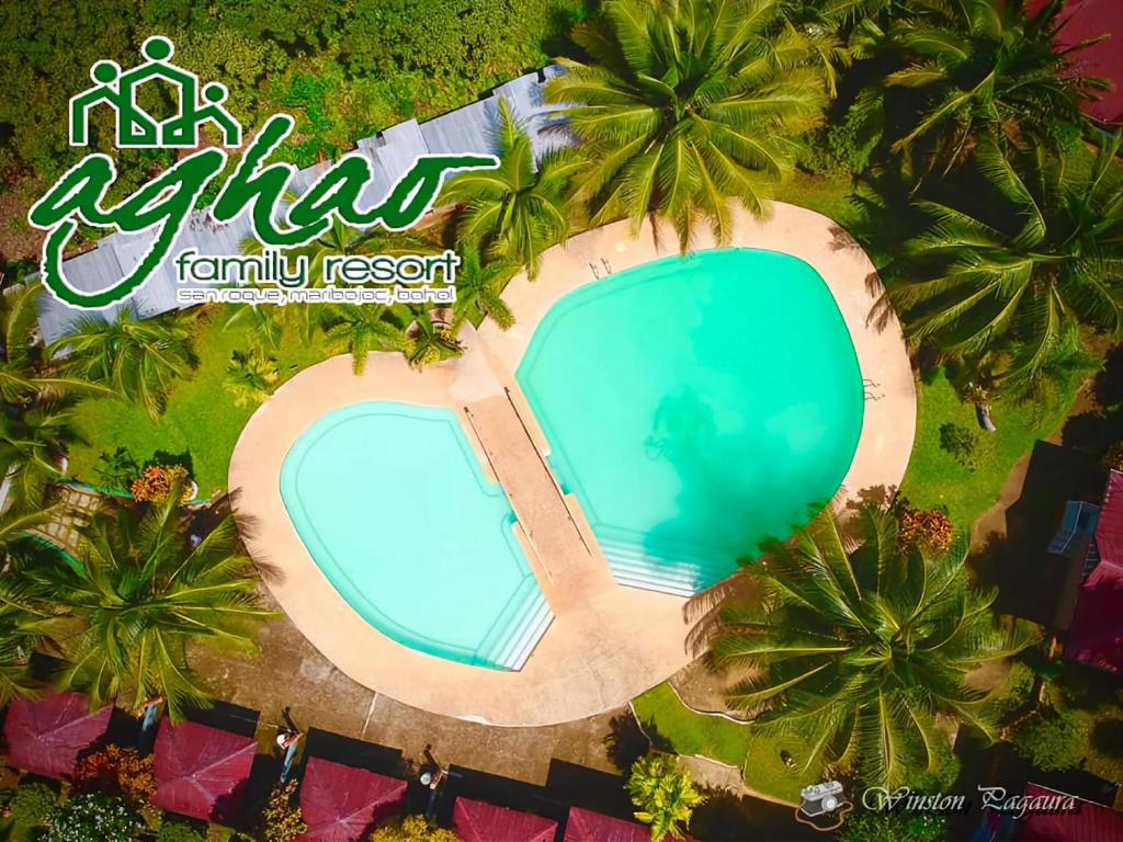 an overhead view of a swimming pool at a resort at AGHAO MIDGREENS RESORT 