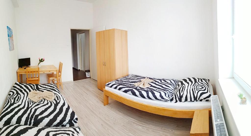 Postel nebo postele na pokoji v ubytování Hotel Slobi