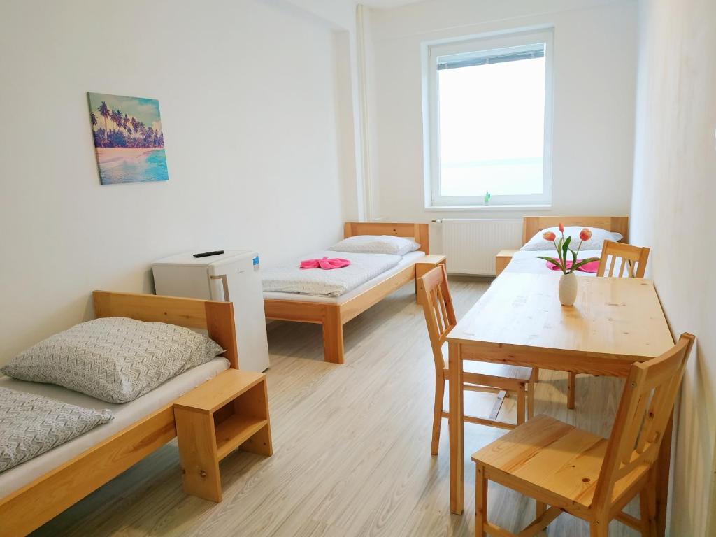 Postel nebo postele na pokoji v ubytování Hotel Slobi