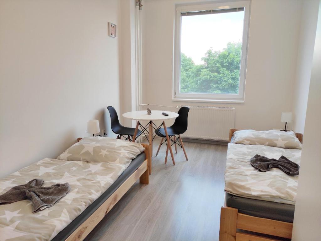 Postel nebo postele na pokoji v ubytování Hotel Slobi