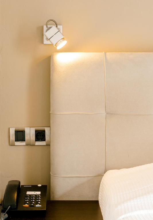 Postel nebo postele na pokoji v ubytování Plaza Hotel