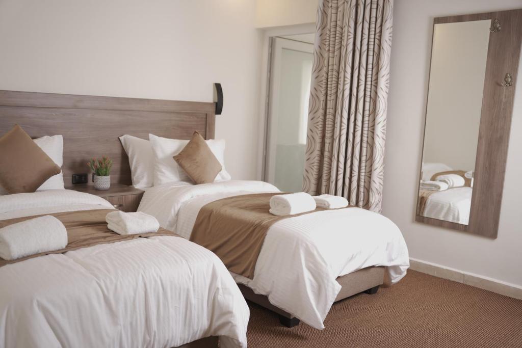 Un pat sau paturi într-o cameră la Petra Passion Inn