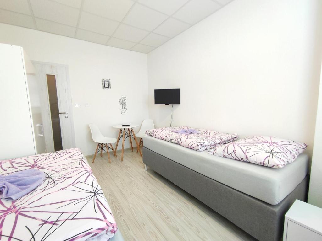 Postel nebo postele na pokoji v ubytování Hotel Slobi