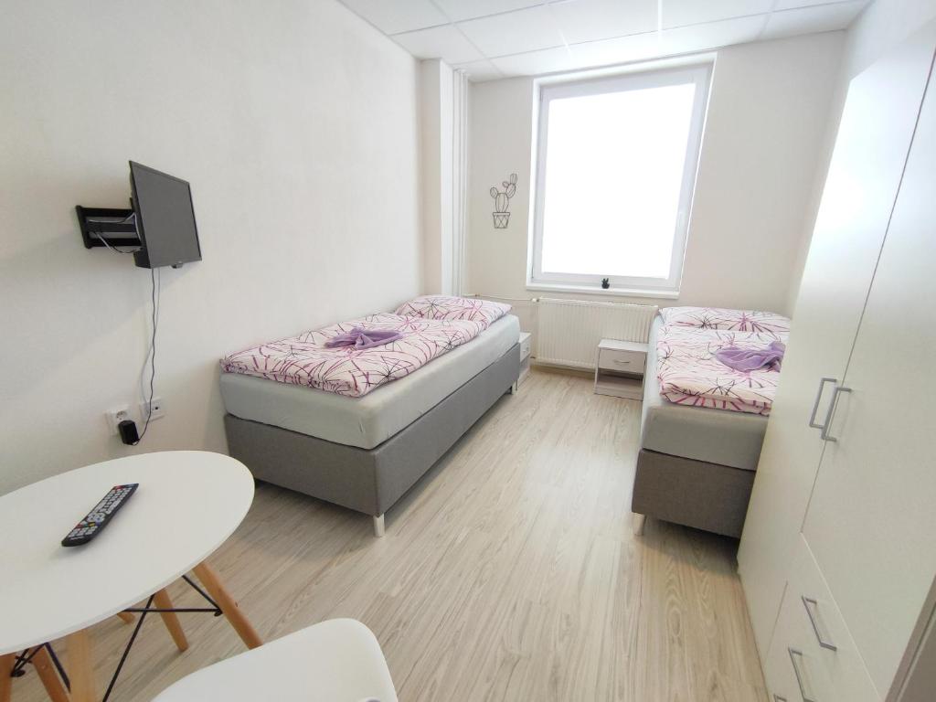 Postel nebo postele na pokoji v ubytování Hotel Slobi