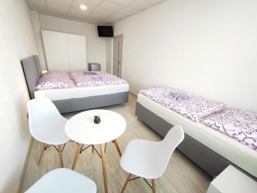 Postel nebo postele na pokoji v ubytování Hotel Slobi