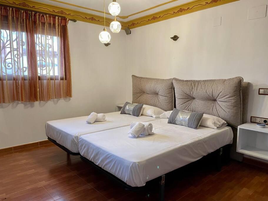 Postel nebo postele na pokoji v ubytování El Rincón de la Mezquita 2