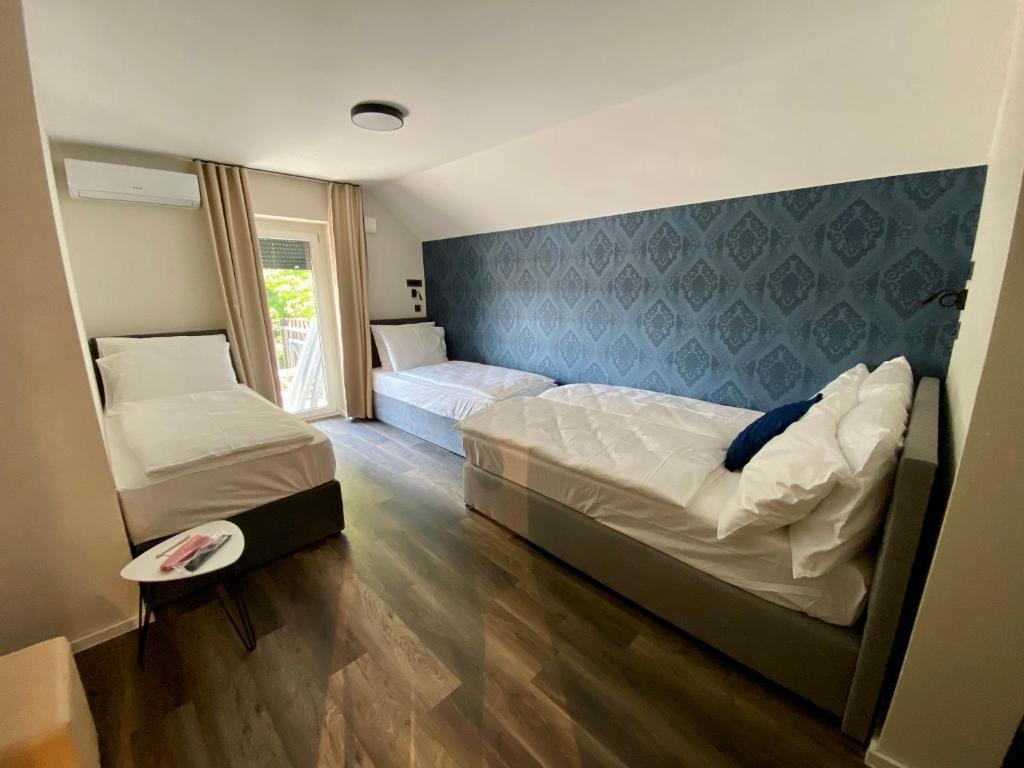 Postel nebo postele na pokoji v ubytování Boutique hotel ZBILJE