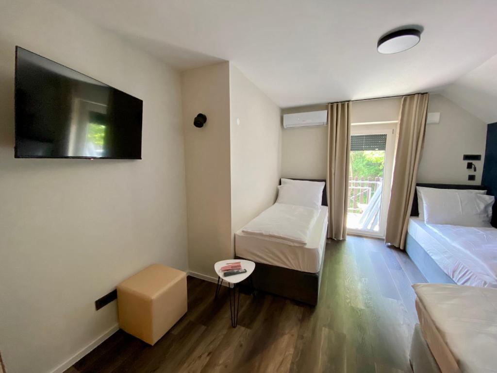 Postel nebo postele na pokoji v ubytování Boutique hotel ZBILJE