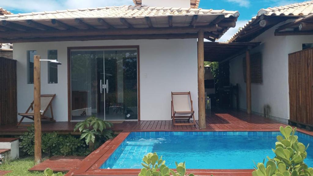 a swimming pool in front of a house at Casa, 2 Suítes com Ar, Piscina a 400 mts Praia - Taipu de Fora, Barra Grande #2 in Marau