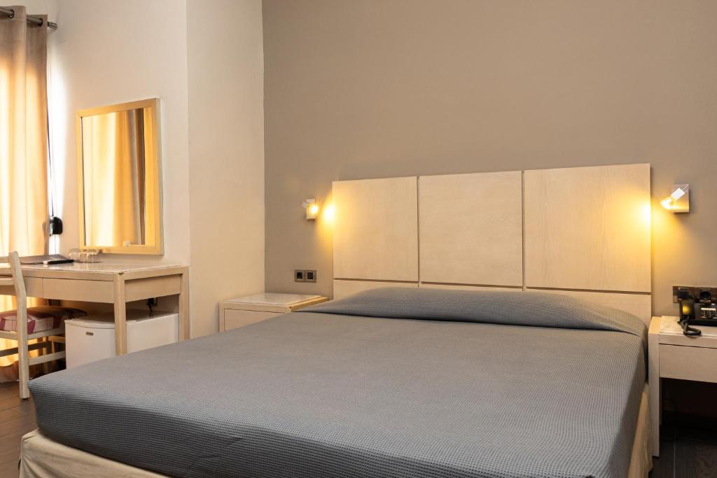 Postel nebo postele na pokoji v ubytování Plaza Hotel