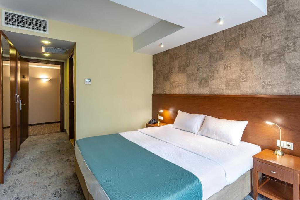 Postel nebo postele na pokoji v ubytování A5 Hotel