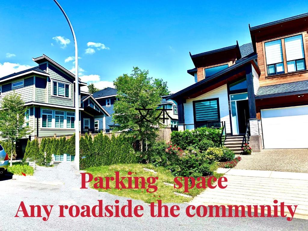 a house with the words parking space any roadside the community at Deluxe House in Surrey
