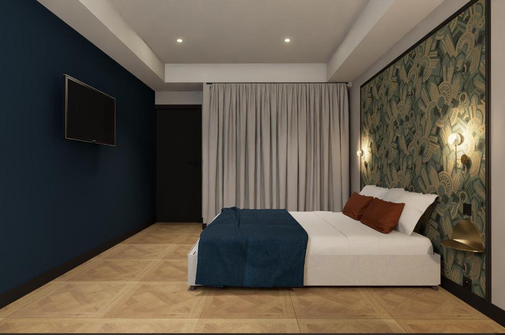Postel nebo postele na pokoji v ubytování Grand Hôtel de la Scala