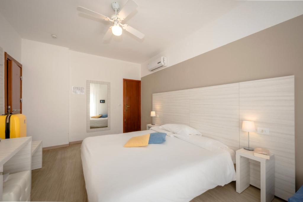 Postel nebo postele na pokoji v ubytování Hotel Etna