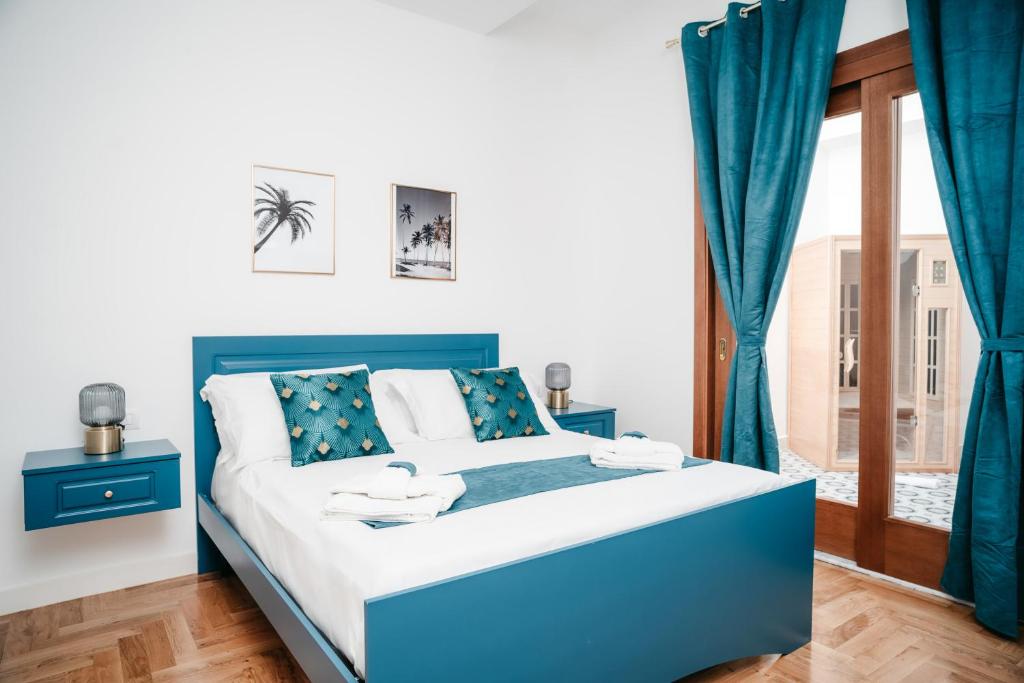 A bed or beds in a room at Vista Napoli Residence by Casa Napoletana