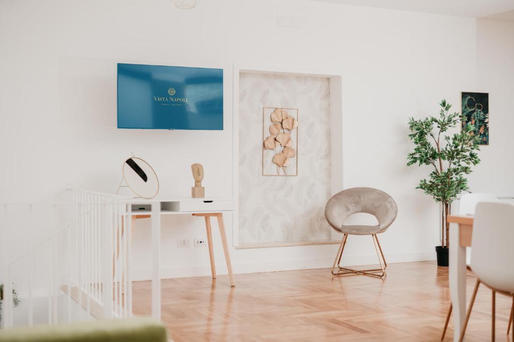 A television and/or entertainment centre at Vista Napoli Residence by Casa Napoletana