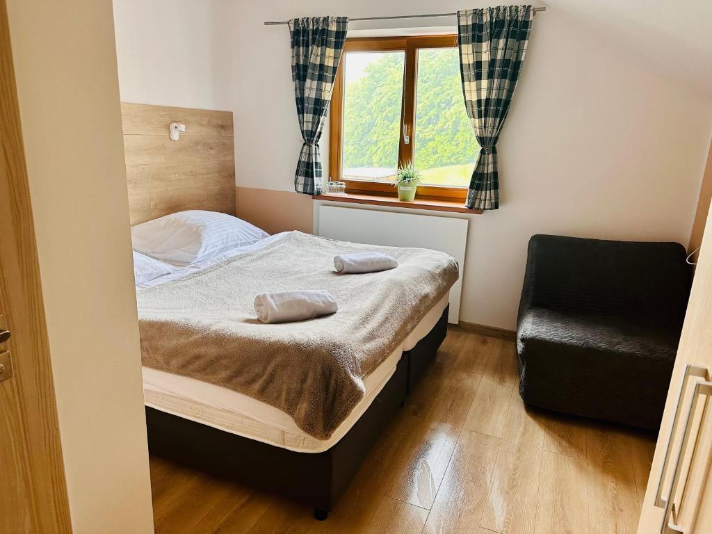 Postel nebo postele na pokoji v ubytování Chata pod Lysou