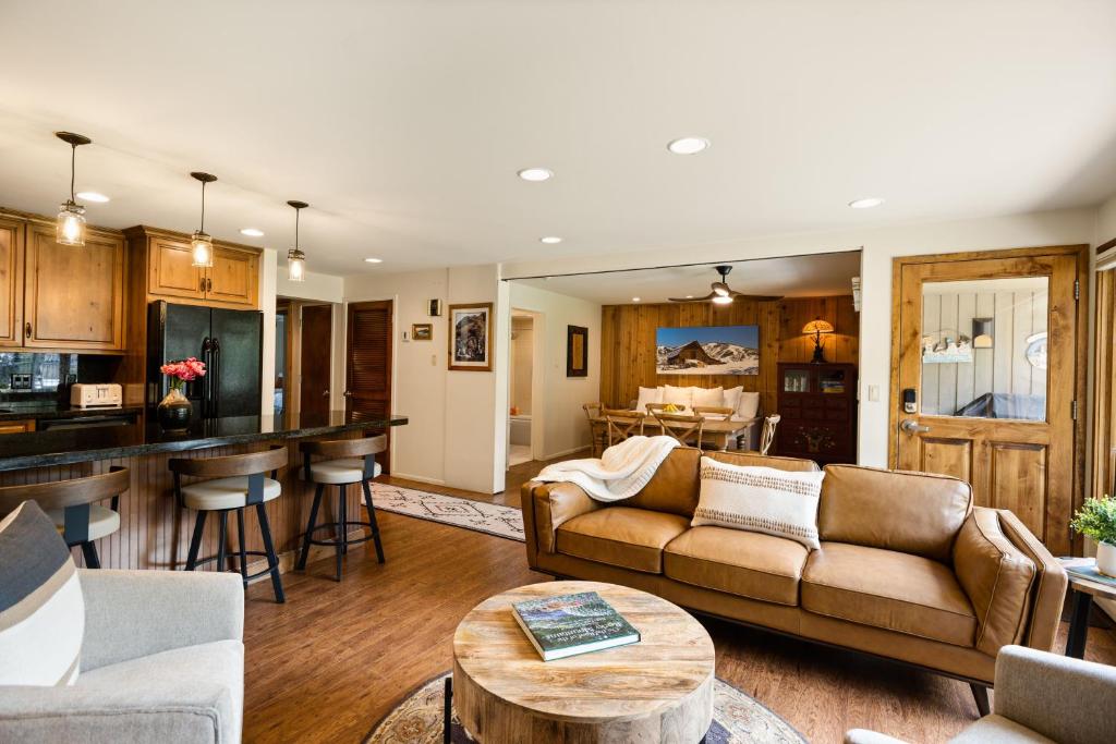 a living room with a couch and a table at Shadowbrook 402 in Snowmass Village