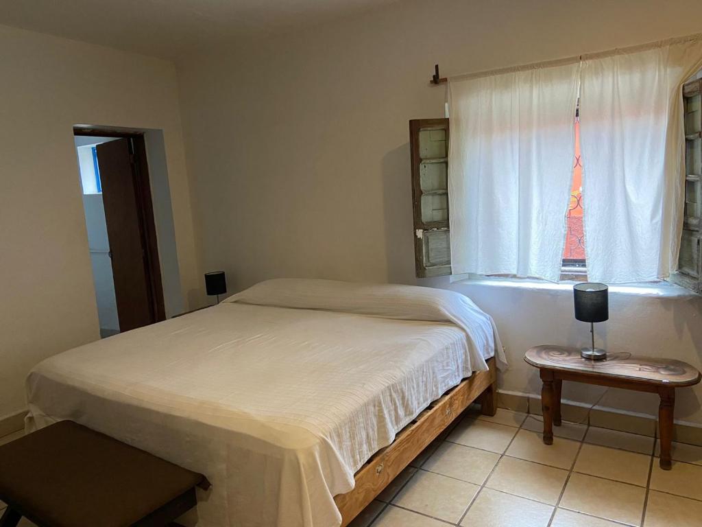 Postel nebo postele na pokoji v ubytování Mesón Don Quijote
