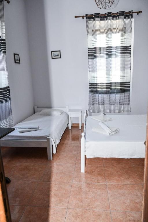 Postel nebo postele na pokoji v ubytování Nymph