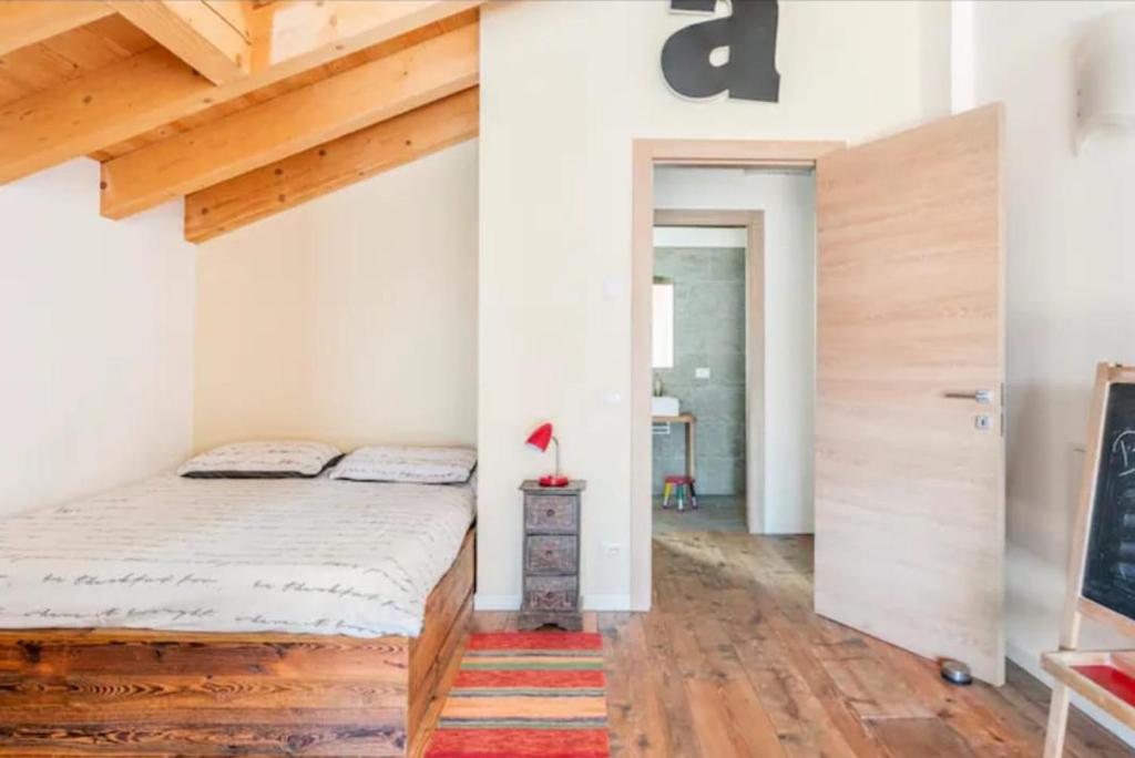 Postel nebo postele na pokoji v ubytování Foresteria B&B Vecchiascuola Pianazzola
