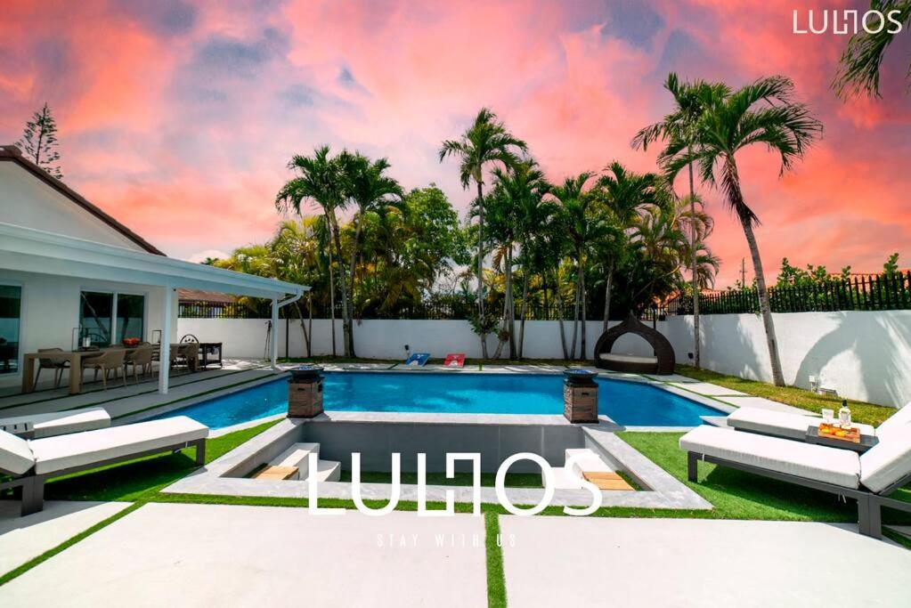 a swimming pool in the backyard of a house at Entertainment Elegance - Miami Villa L33 in Tamiami