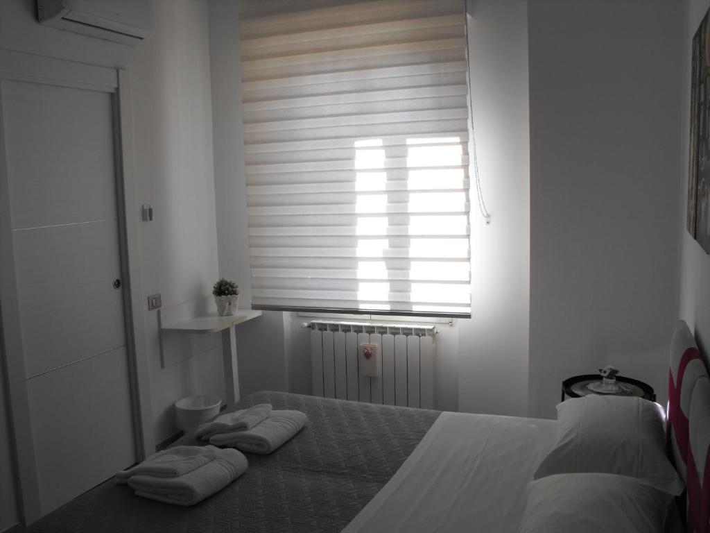 Postel nebo postele na pokoji v ubytování Dimora Chlóe B&B