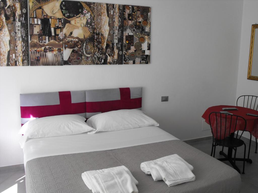 Postel nebo postele na pokoji v ubytování Dimora Chlóe B&B