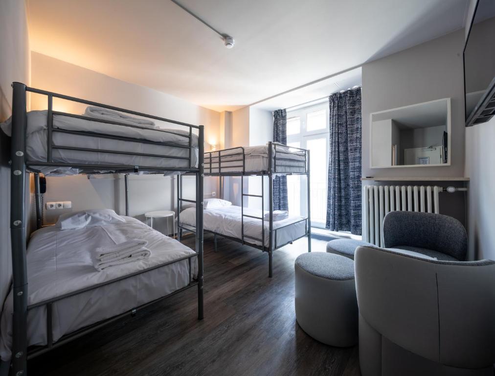 Postel nebo postele na pokoji v ubytování Hotel Bristol