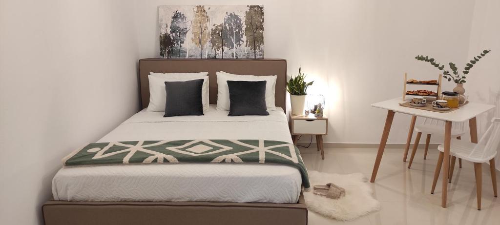 EZITH LUXURY APARTMENTSにあるベッド