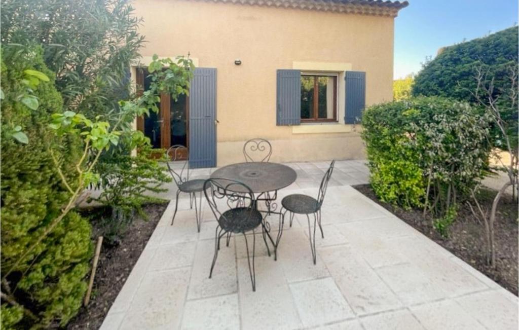 a patio with chairs and a table in front of a house at Amazing Home In Mazan With Wifi in Mazan