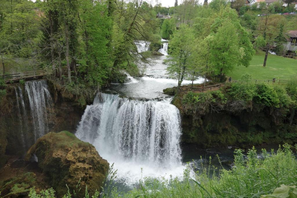 a waterfall on the side of a river at Apartment Ante in Slunj