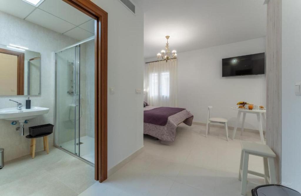 Televízia a/alebo spoločenská miestnosť v ubytovaní Villa Augusto Cosy Romance