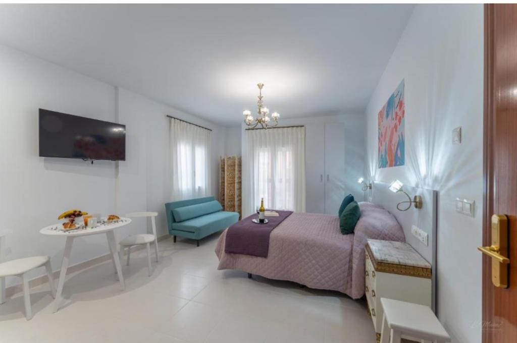 Televízia a/alebo spoločenská miestnosť v ubytovaní Villa Augusto Cosy Romance