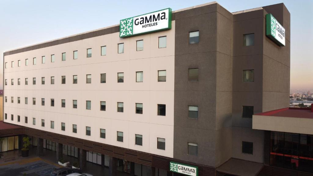 a building with a sign on top of it at GAMMA Querétaro in Querétaro