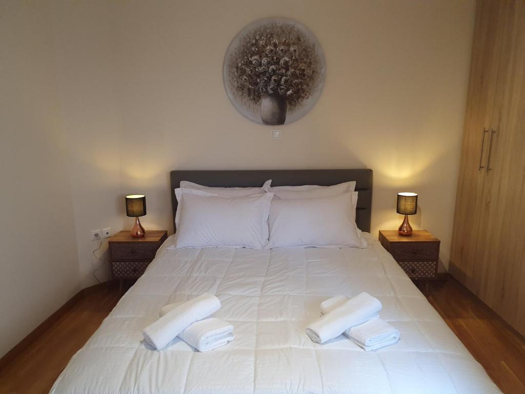 Ένα ή περισσότερα κρεβάτια σε δωμάτιο στο Lux & Style 75sqm with Private Parking in Athens