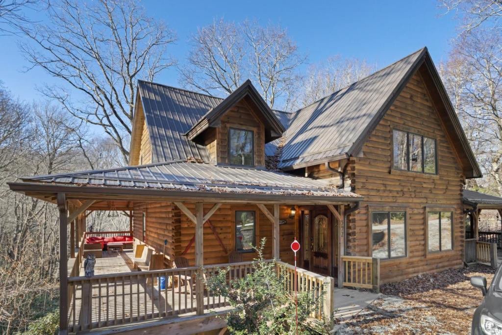 a log cabin with a gambrel roof at Fire And Ice in Blowing Rock