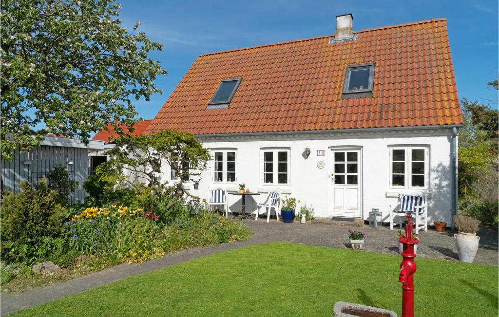 a white cottage with an orange roof at Beautiful Home In Grlev With Wifi in Gørlev