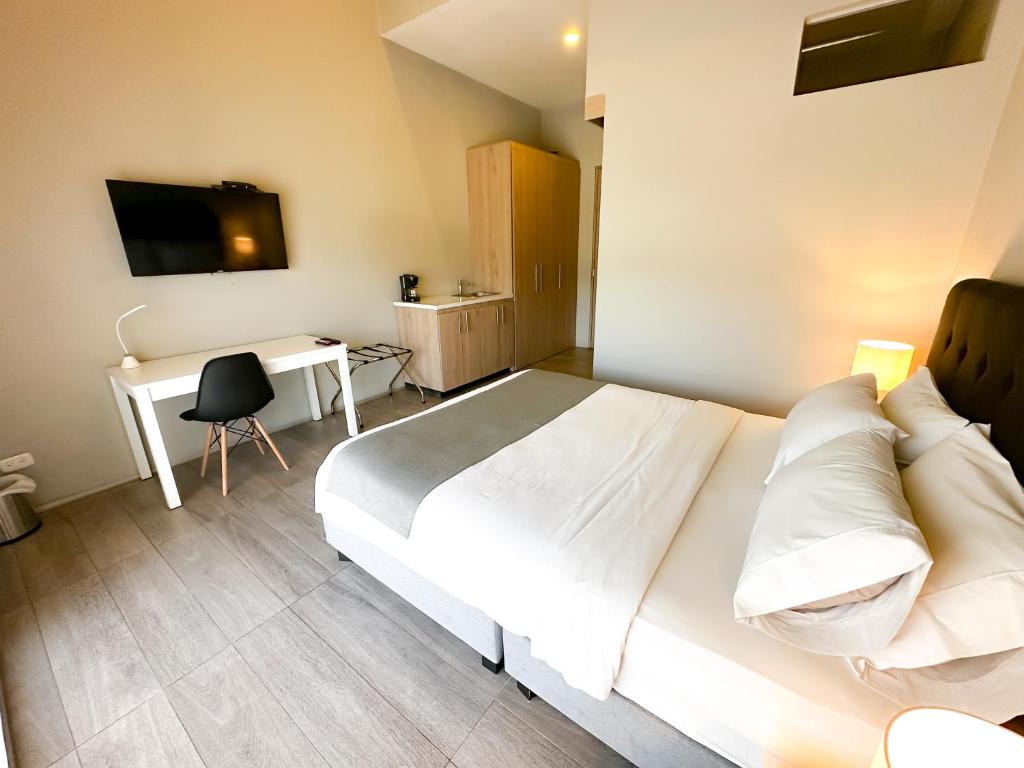 TV a/nebo společenská místnost v ubytování Hotel Arena Suites Movistar Arena