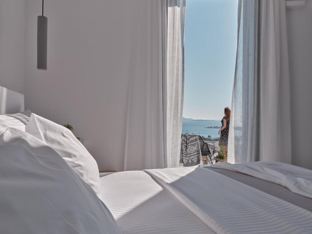Postel nebo postele na pokoji v ubytování Olithos Villas