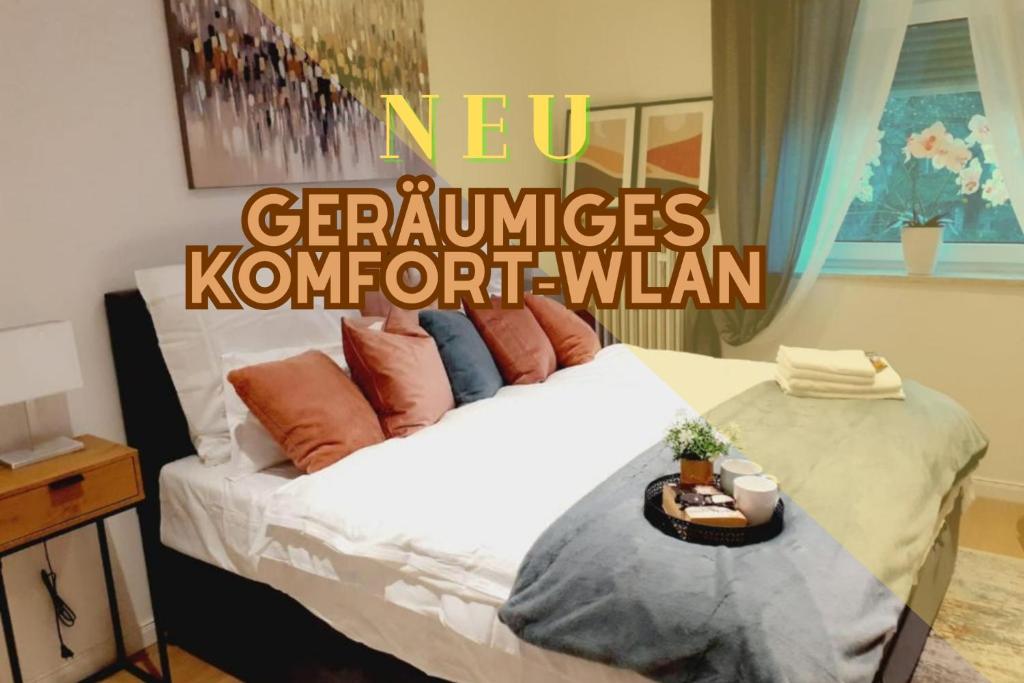 a bedroom with a white bed with pillows at NEW - Apartment Kameni Confort Wifi Munich Airport Family in Neufahrn bei Freising