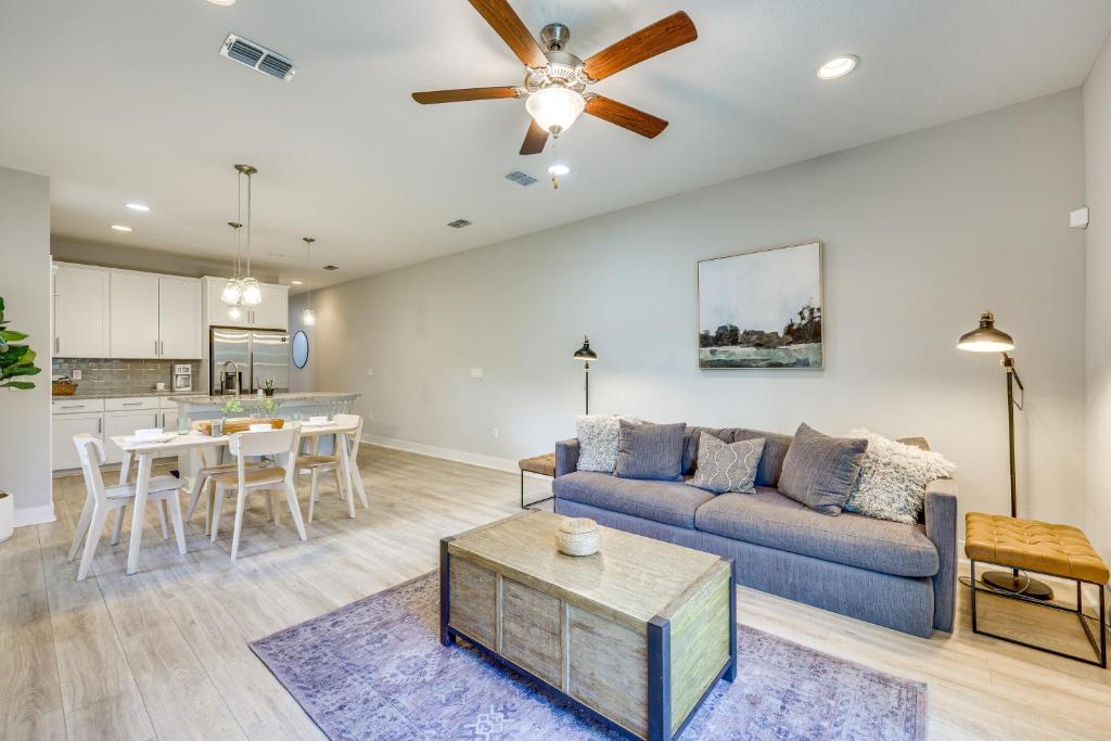 a living room with a couch and a table at Pet-Friendly Townhome, 1 Mi to Southbank Riverwalk in Jacksonville